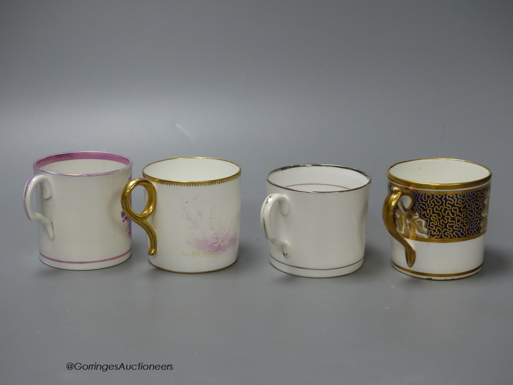 Four coffee cans Minton painted in Watteauseque style made for A.B.Daniell, another Minton with purple landscape, a Herculaneum with landscape, and a Miles Mason blue and gilt